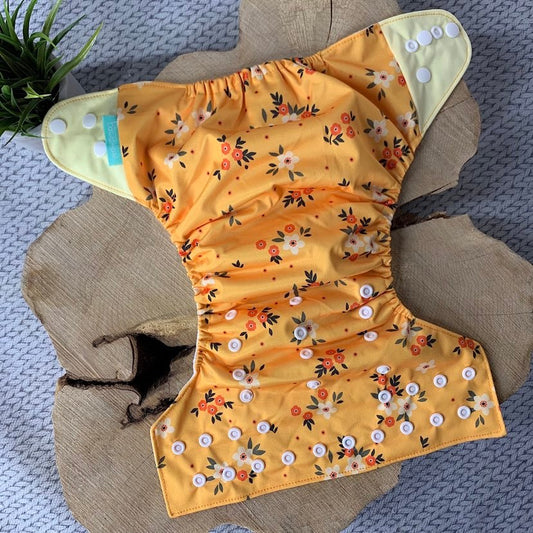 Couche lavable fleur moutarde